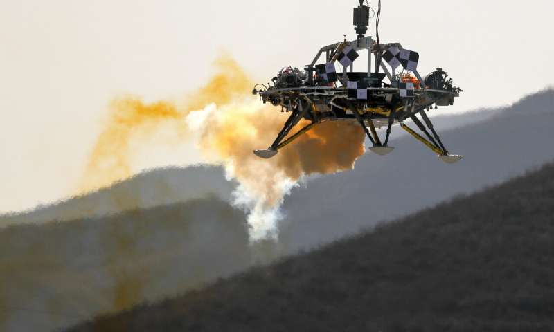 In this Thursday, Nov. 14, 2019 file photo, the Mars lander's hovering, obstacle avoidance and deceleration capabilities are tested at a facility at Huailai in China's Hebei province. China will launch their Mars rover and an orbiter sometime around July 23, 2020, in a mission named Tianwen, or Questions for Heaven. (AP Photo/Andy Wong) Look out, Mars: Here we come with a fleet of spacecraft