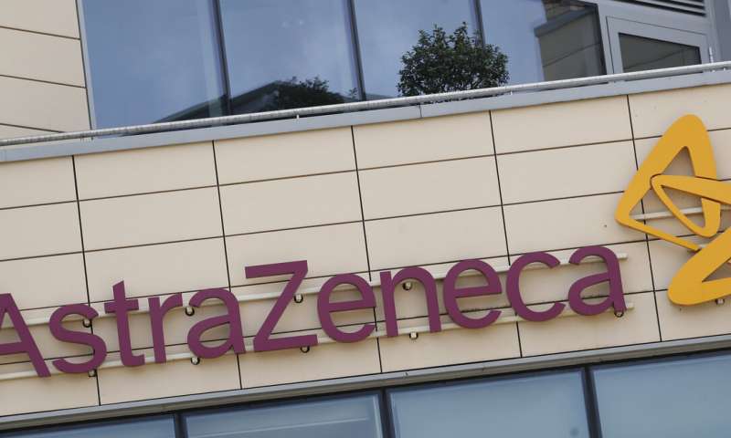 This Saturday, July 18, 2020 file photo shows a general view of AstraZeneca offices and the corporate logo in Cambridge, England. Late stage trials into a coronavirus vaccine developed by Oxford University and drugmaker AstraZeneca were paused after a woman who received the experimental shot developed severe neurological symptoms, a spokesman for the pharmaceutical said Thursday, Sept. 10, 2020. (AP Photo/Alastair Grant, file) Vaccine trial stopped after neurological symptoms detected
