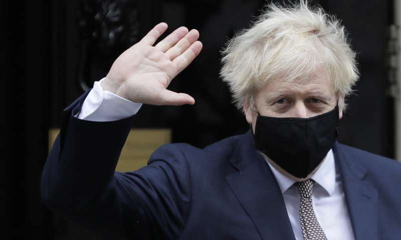 Britain's Prime Minister Boris Johnson waves as he leaves 10 Downing Street in London, Thursday, Nov. 26, 2020. Johnson leaves self-quarantine today after having close contact with a lawmaker who contracted the coronavirus in mid November. (AP Photo/Kirsty Wigglesworth) Pubs to stay shut in many areas in new English virus curbs