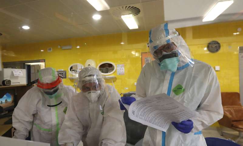 Healthcare workers attending to COVID-19 patients in an intensive care unit (ICU) at Na Bulovce hospital in Prague, Czech Republic, Thursday, Oct. 1, 2020. A record surge of new coronavirus infections in the Czech Republic in September has been followed by a record surge of those hospitalized with COVID-19. The development has started to put the health system in the country under serious pressure for the first time since the pandemic hit Europe. (AP Photo/Petr David Josek) Czech Republic tops record infection surge in Eastern Europe
