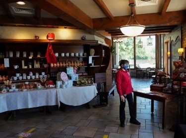 Manager Flory Ramirez waits for customers as restaurants are reopened following the lifting of some restrictions in place to prevent the spread of COVID-19 in Houston, Texas, May 1, 2020, photo by Go Nakamura/Reuters