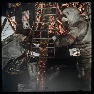Astronaut working at lunar outpost.