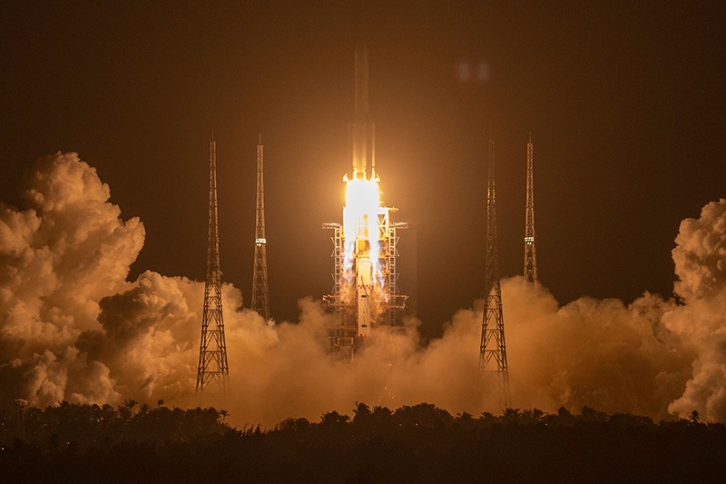 A rocket takes off amid clouds of vapour.