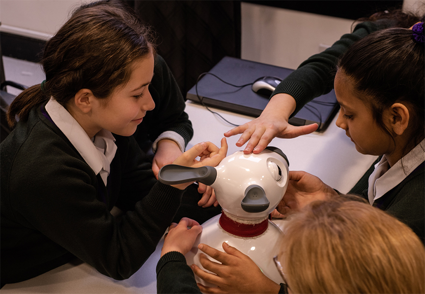 Children playing with a companion robot