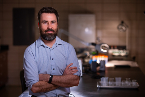 Andrew Somerville standing in his lab on campus