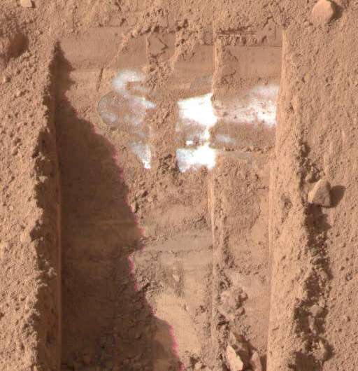 NASA's Phoenix Mars Lander shows the trench, called 'Dodo-Goldilocks,' lacking lumps of ice seen previously. The ice had sublimated, a process similar to evaporation, over the course of four days. Credit: NASA/JPL-Caltech/University of Arizona/Texas A&M University Where should future astronauts land on Mars? Follow the water