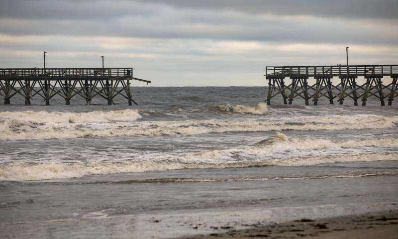 The private Sea Cabins pier is seen damaged following Hurricane Isaias, in North Myrtle Beach, S.C., Tuesday, Aug. 4, 2020. (Jason Lee/The Sun News via AP) Tropic storm Isaias whips up eastern US, killing at least 6