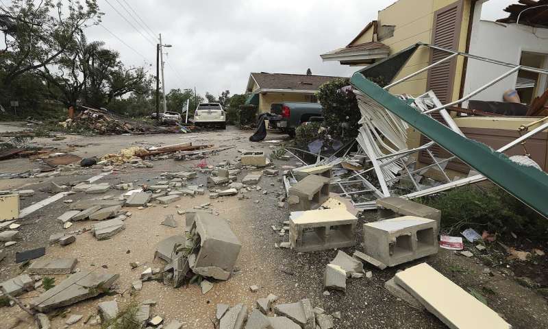Debris is strewn in front of Lake Margaret Village Apartments Sunday, June 7, 2020, following a tornado that struck late Saturday, in Orlando, Fla. (Stephen M. Dowell/Orlando Sentinel via AP) Rain, road flooding as Tropical Storm Cristobal draws closer