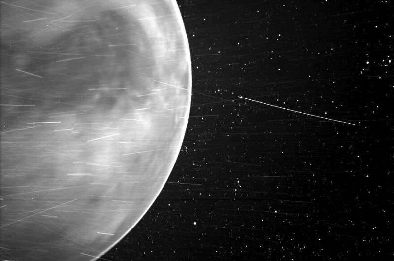 When flying past Venus in July 2020, Parker Solar Probe's WISPR instrument, short for Wide-field Imager for Parker Solar Probe, detected a bright rim around the edge of the planet that may be nightglow -- light emitted by oxygen atoms high in the atmosphere that recombine into molecules in the nightside. The prominent dark feature in the center of the image is Aphrodite Terra, the largest highland region on the Venusian surface. Bright streaks in WISPR, such as the ones seen here, are typically caused by a combination of charged particles -- called cosmic rays -- sunlight reflected by grains of space dust, and particles of material expelled from the spacecraft's structures after impact with those dust grains. The number of streaks varies along the orbit or when the spacecraft is traveling at different speeds, and scientists are still in discussion about the specific origins of the streaks here. The dark spot appearing on the lower portion of Venus is an artifact from the WISPR instrument. Credit: NASA/Johns Hopkins APL/Naval Research Laboratory/Guillermo Stenborg and Brendan Gallagher Parker Solar Probe offers stunning view of Venus