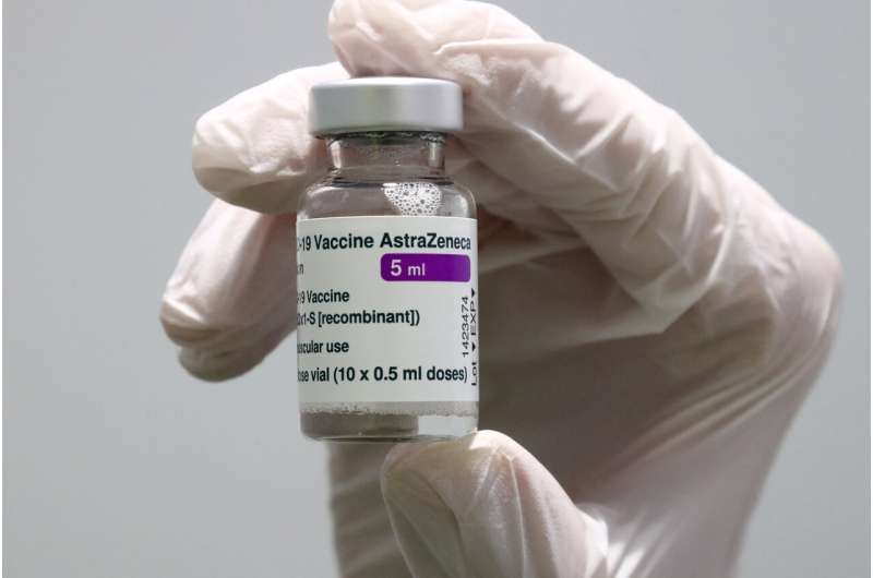 In this Monday, March 22, 2021 file photo medical staff prepares an AstraZeneca coronavirus vaccine during preparations at the vaccine center in Ebersberg near Munich, Germany. British authorities recommended Wednesday, April 7, that the AstraZeneca COVID-19 vaccine not be given to adults under 30 where possible because of strengthening evidence that the shot may be linked to rare blood clots. The recommendation came as regulators both in the U.K. and the European Union emphasized that the benefits of receiving the vaccine continue to outweigh the risks for most people. (AP Photo/Matthias Schrader, File) UK advises limiting AstraZeneca in under-30s amid clot worry