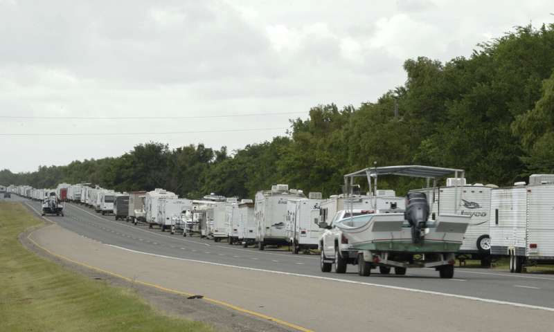 Recreational trailers and boats are parked along LA-46 inside the levee gates in anticipation of Tropical Storm Cristobal in St. Bernard Parish, La., Saturday, June 6, 2020. A re-energized Tropical Storm Cristobal advanced toward the U.S. Gulf Coast early Saturday, bringing with it the heavy rains that already caused flooding and mudslides in Mexico and Central America. (Max Becherer/The Times-Picayune/The New Orleans Advocate) Rain, road flooding as Tropical Storm Cristobal draws closer