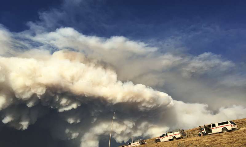 Firefighters monitor the Cameron Peak Fire in Rocky Mountain National Park, Sept. 5, 2020. Credit: Karina Puikkonen New fire containment research addresses risk and safety