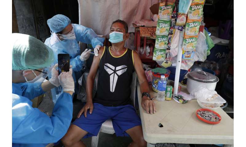 Restrictions reimposed as virus resurges in much of Asia