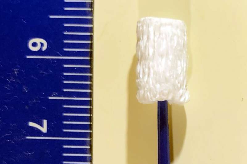A new type of nanofiber swab could improve sample collection and test sensitivity for SARS-CoV-2 and other biological specimens; ruler at left shows centimeters. Credit: Adapted from <i>Nano Letters</i> 2021, DOI: 10.1021/acs.nanolett.0c04956 Ultra-absorptive nanofiber swabs could improve SARS-CoV-2 test sensitivity