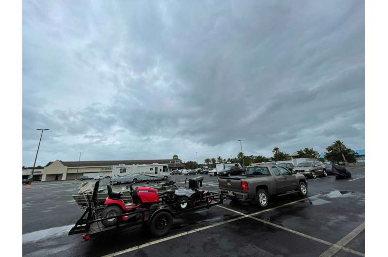 Residents in low-lying areas of Hancock County move their vehicles, lawn mowers, ATVs and boats to higher ground in Waveland, Miss., as a tropical system approaches Friday, June 18, 2021. Forecasters predict a tropical system will bring heavy rain, storm surge and coastal flooding to the U.S. Gulf Coast. The poorly organized disturbance was located Friday morning about 255 miles south of Morgan City, Louisiana. Credit: Justin Mitchell/The Sun Herald via AP Major damage to Alabama mobile home park amid tropical storm