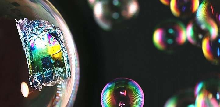 The fully printed ultrathin solar cell is light and flexible enough to rest on the surface of a soap bubble. Credit: 2020 KAUST; Anastasia Serin Thin-skinned solar panels printed with inkjet