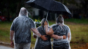 Relatives attend a COVID-19 victim's burial in Manaus, Brazil