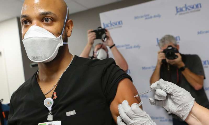 Medical staff and vulnerable patients were among the first to be vaccinated in the US