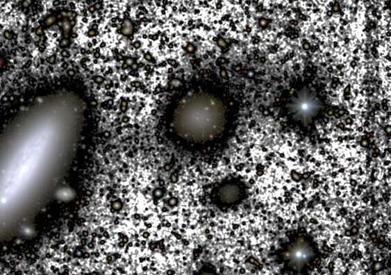 At first glance, the galaxy NGC1052-DF4 (centre) appears to be intact. But faint stars leaving the galaxy – shown by the grey shading in this composite colour image – reveals the galactic theft at play. NGC1035 is the large galaxy to its left. Credit: M. Montes et al. The case of the missing dark matter: new suspect found in galactic mystery