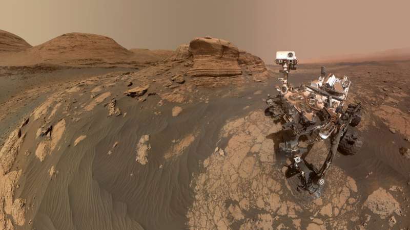 NASA’s Curiosity Mars rover used two cameras to create this selfie in front of Mont Mercou, a rock outcrop that stands 20 feet (6 meters) tall. The panorama is made up of 60 images from the MAHLI camera on the rover’s robotic arm along with 11 images from the Mastcam on the mast, or “head,” of the rover. Credit: NASA/JPL-Caltech/MSSS NASA's Curiosity Mars Rover Takes Selfie With 'Mont Mercou'