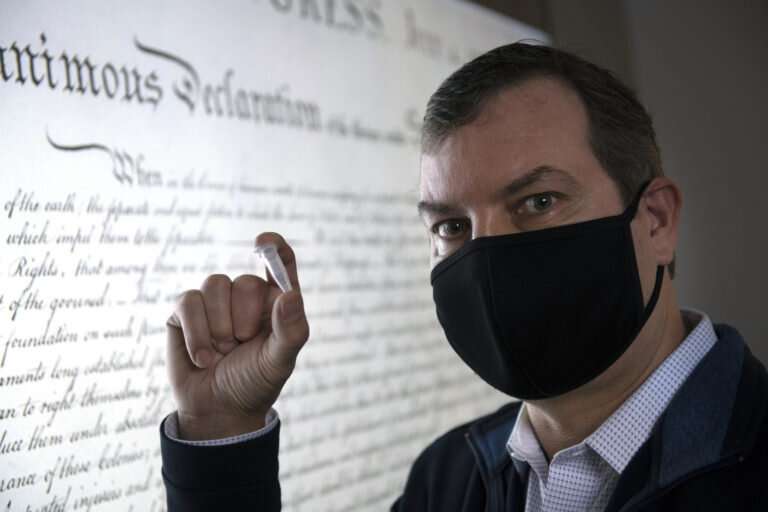 UCI’s John Chaput and his team have transcribed the Declaration of Independence and the UCI seal to a solution of TNA and recovered them. Credit: Steve Zylius / UCI Researchers can store the Declaration of Independence in a single molecule