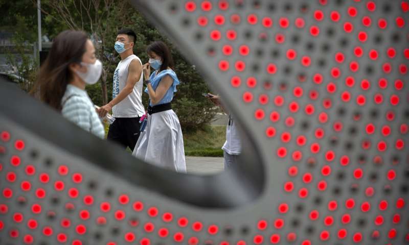 China tames new outbreak but elsewhere virus cases surge