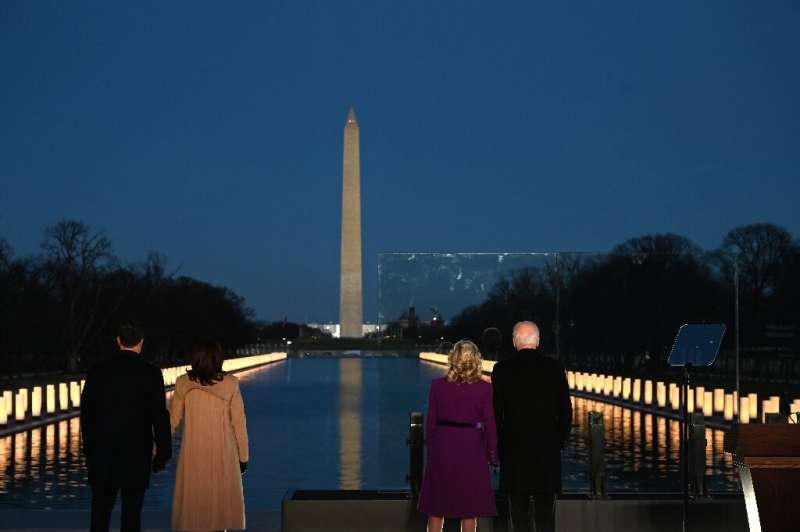President-elect Joe Biden (R) and incoming First Lady Jill Biden watch as a Covid-19 memorial is lit in Washington, DC President-elect Joe Biden (R) and incoming First Lady Jill Biden watch as a Covid-19 memorial is lit in Washington, DC
