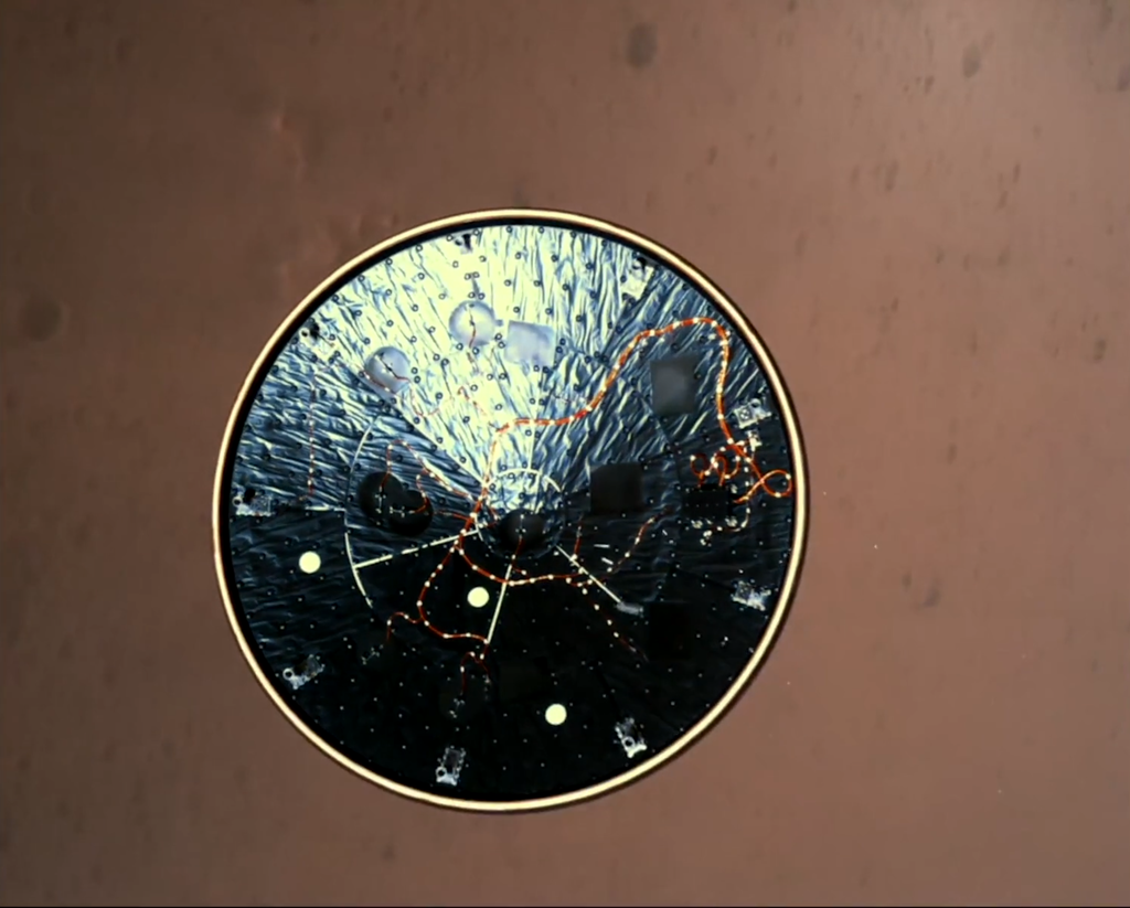 The Mars 2020 spacecraft’s heat shield falls away as the aeroshell descends to Mars on Feb. 18, 2021