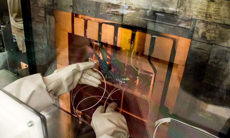 A worker in the ultra-low radiation detection facility at the Shallow Underground Laboratory located at Pacific Northwest National Laboratory. Credit: Andrea Starr, PNNL Natural radiation can interfere with quantum computers