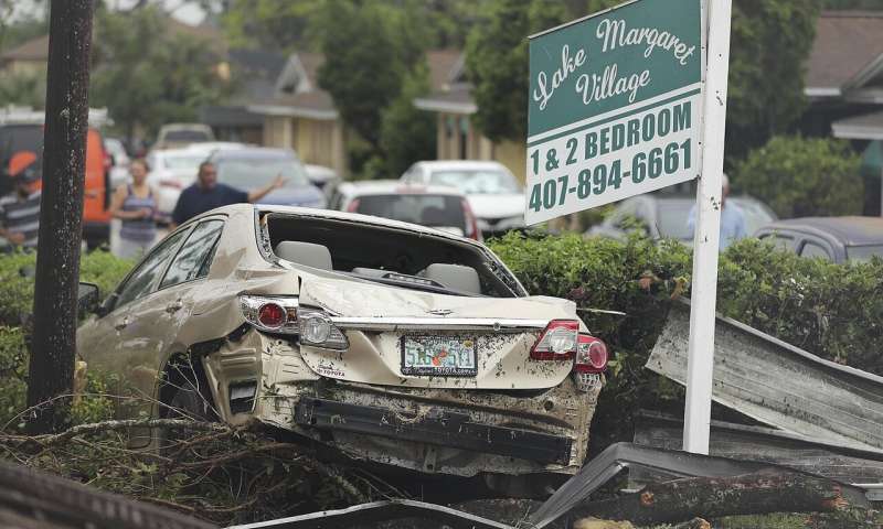 A damaged vehicle and debris sit in front of Lake Margaret Village Apartments Sunday, June 7, 2020, following a tornado that struck late Saturday, in Orlando, Fla. (Stephen M. Dowell/Orlando Sentinel via AP) Rain, road flooding as Tropical Storm Cristobal draws closer