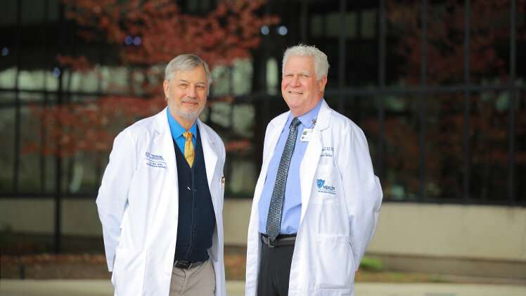 Dr. Blair Grubb, right, a cardiologist at The University of Toledo Medical Center and Distinguished University Professor in the UToledo College of Medicine and Life Sciences, and Dr. William Gunning, a professor of pathology in the UToledo College of Medicine and Life Sciences, continue to build evidence for the theory that postural orthostatic tachycardia syndrome, or POTS, is an autoimmune disorder. Credit: Daniel Miller / The University of Toledo New research adds to evidence that POTS may be an autoimmune disorder