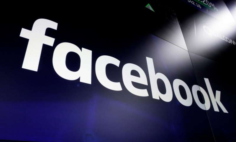 This March 29, 2018 file photo shows the Facebook logo on screens at the Nasdaq MarketSite, in New York's Times Square. Facebook said Thursday Dec. 3, 2020, it will start removing false claims about COVID-19 vaccines, in its latest move to counter a tide of coronavirus-related online misinformation. (AP Photo/Richard Drew, File) Facebook to remove COVID-19 vaccine-related misinformation